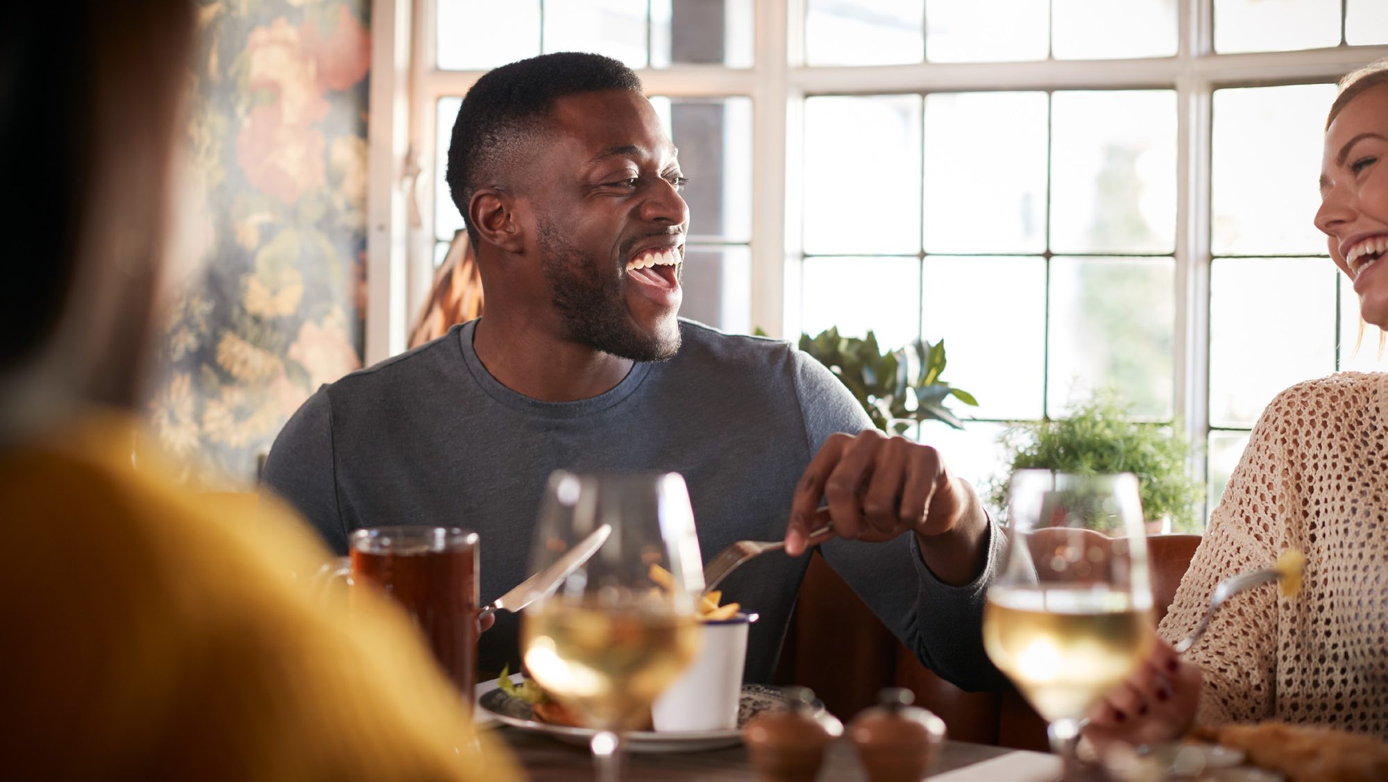 Guests dining together at a restaurant table